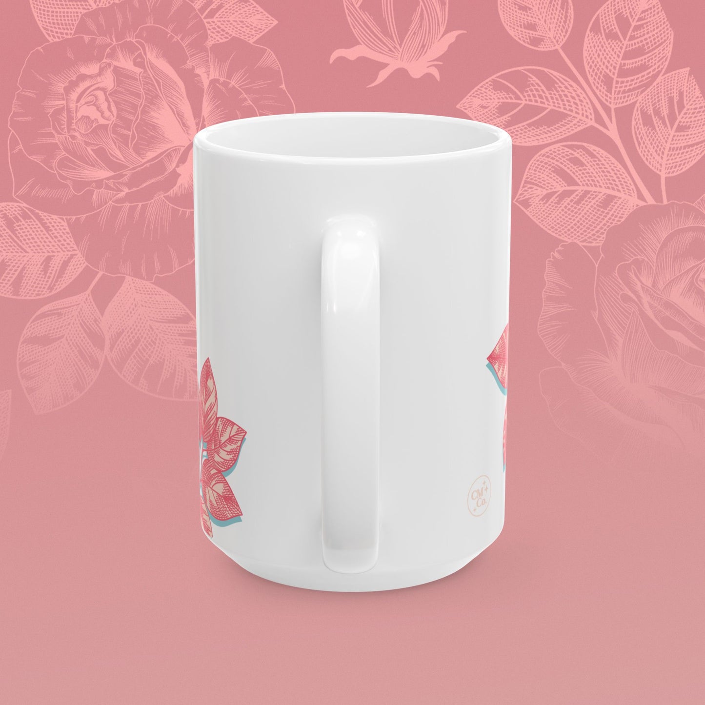 coffee mug decorated with blooming roses in shades of pink.