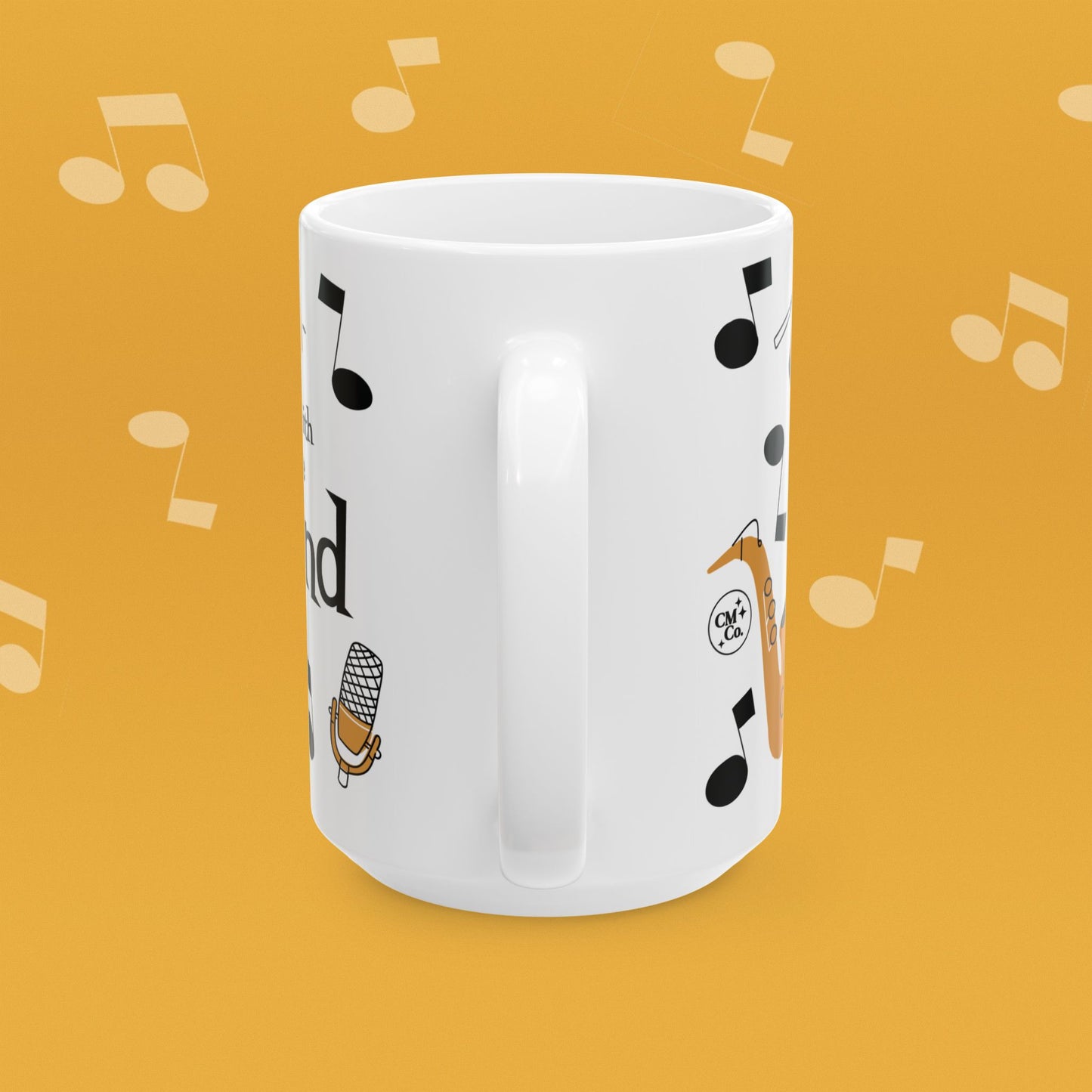 Coffee mug with musical instrument illustrations and text 'I'm with the Band' on a yellow background