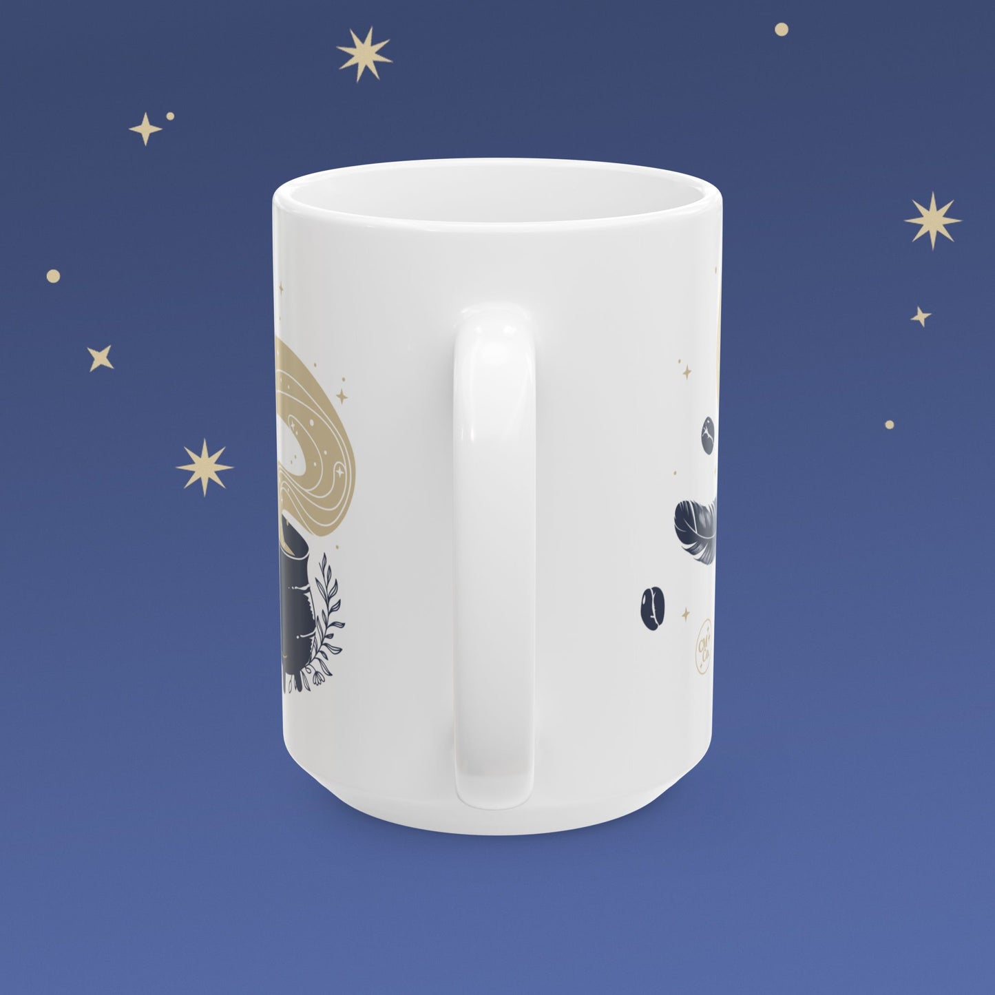 White mug with celestial design on a blue background with stars