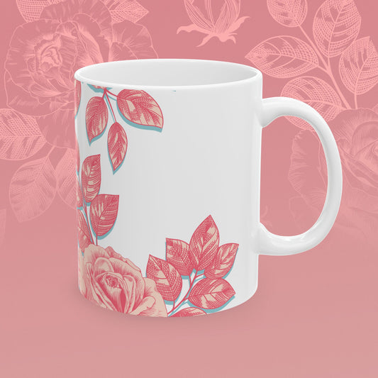 coffee mug decorated with blooming roses in shades of pink.