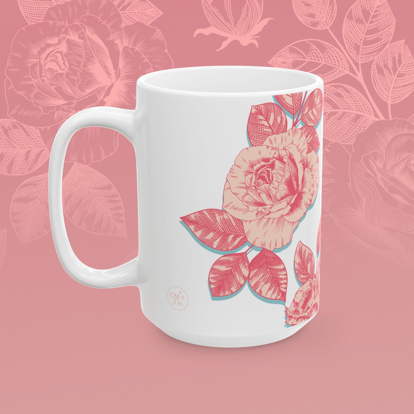 coffee mug decorated with blooming roses in shades of pink.