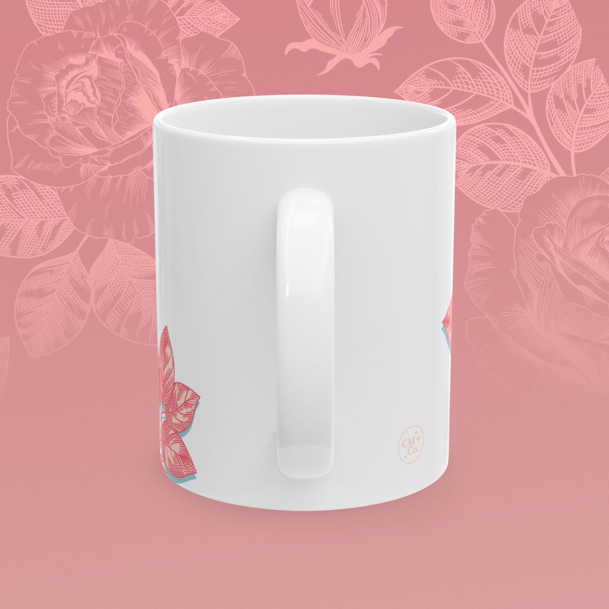 coffee mug decorated with blooming roses in shades of pink.