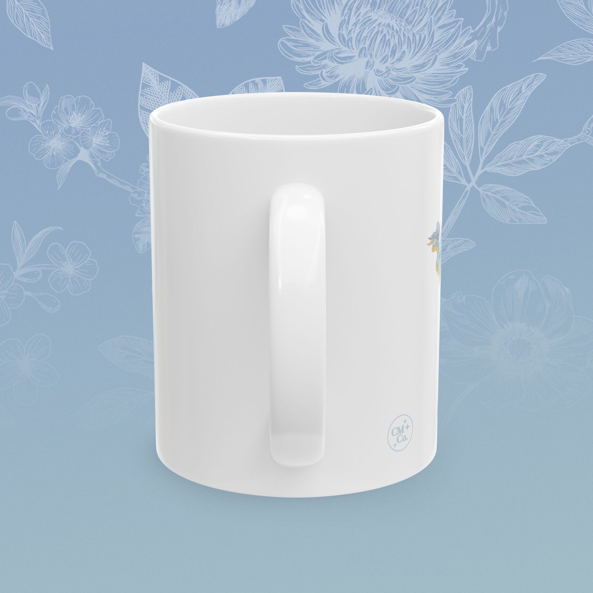 Coffee mug with blue floral pattern