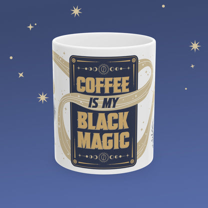 Mug with 'Coffee is my Black Magic' text on a blue background with stars.