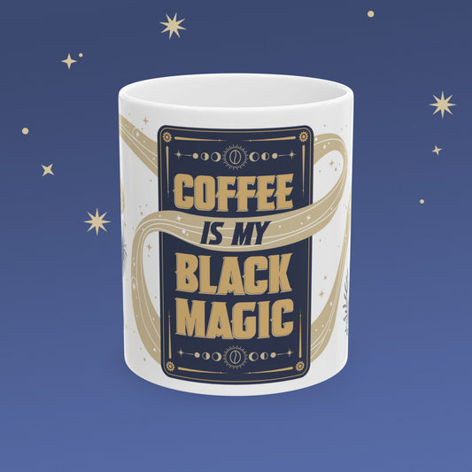 Mug with 'Coffee is my Black Magic' text on a blue background with stars.