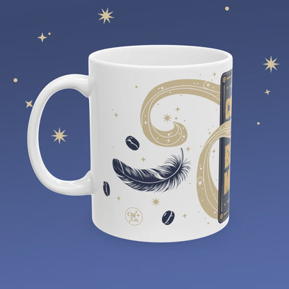White mug with celestial design on a blue background