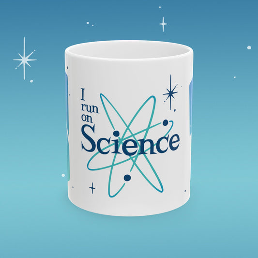 Coffee mug illustrated with image of outer space and retro type that reads "I run on Science"