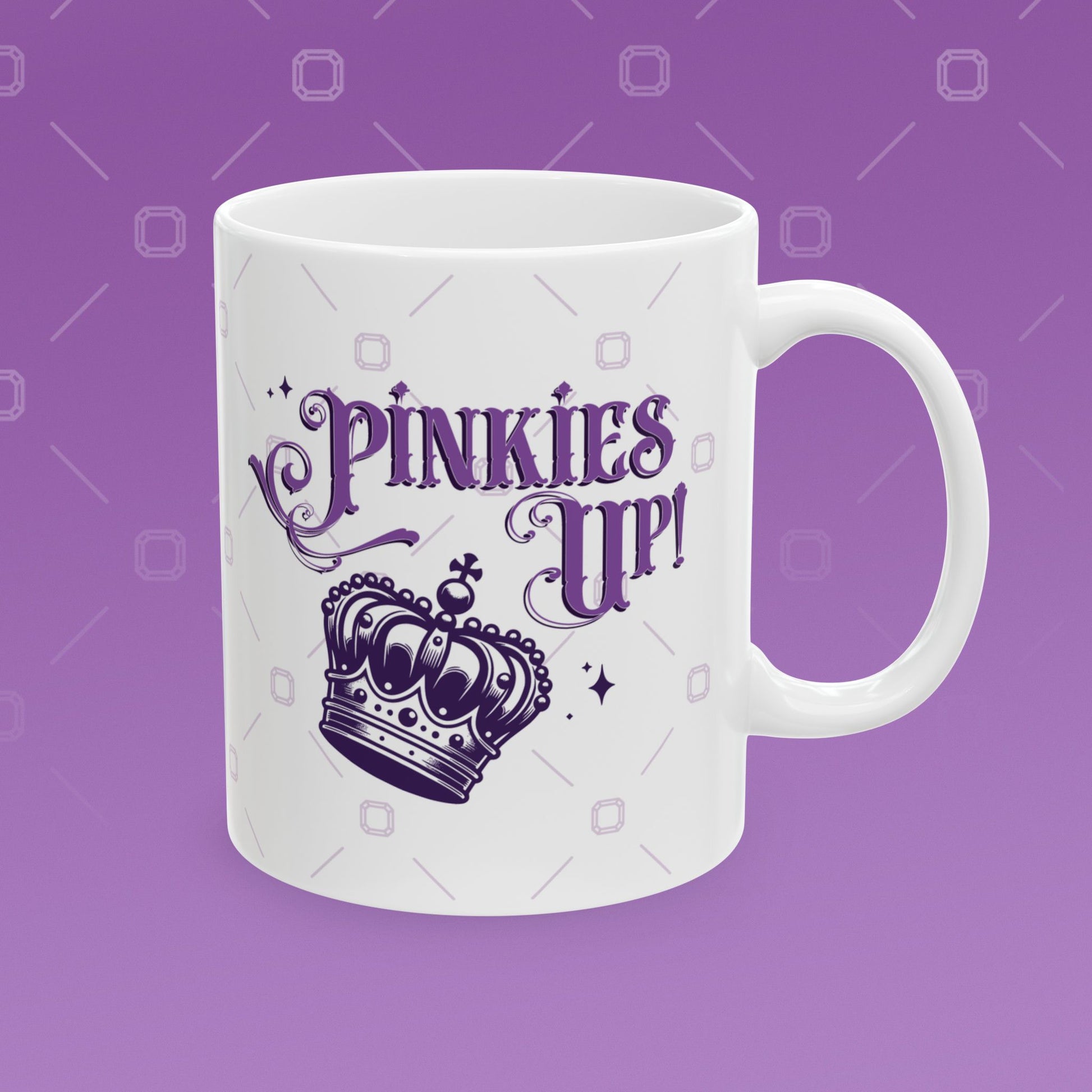 Coffee mug with the fancy text "Pinkies Up" over the illustration of a crown