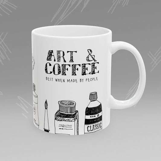 White mug with black text and illustrations of art supplies