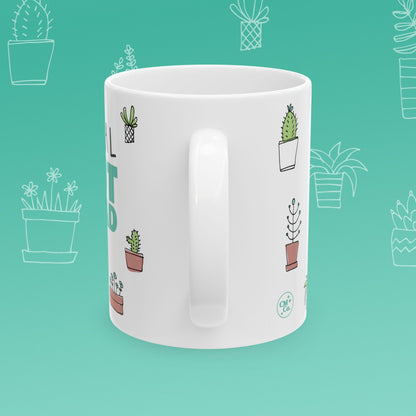 White mug with 'Total Pot Head' text and plant illustrations on a teal background