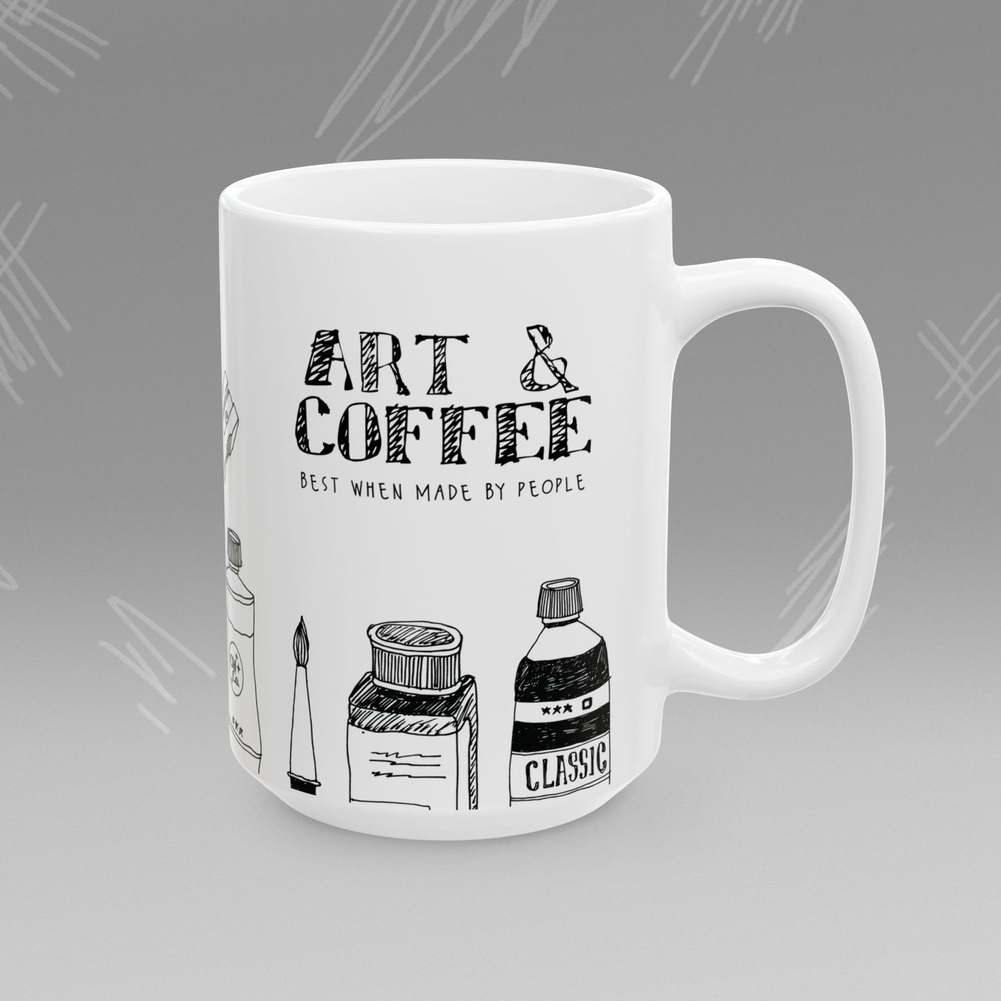White mug with black text and illustrations of art supplies