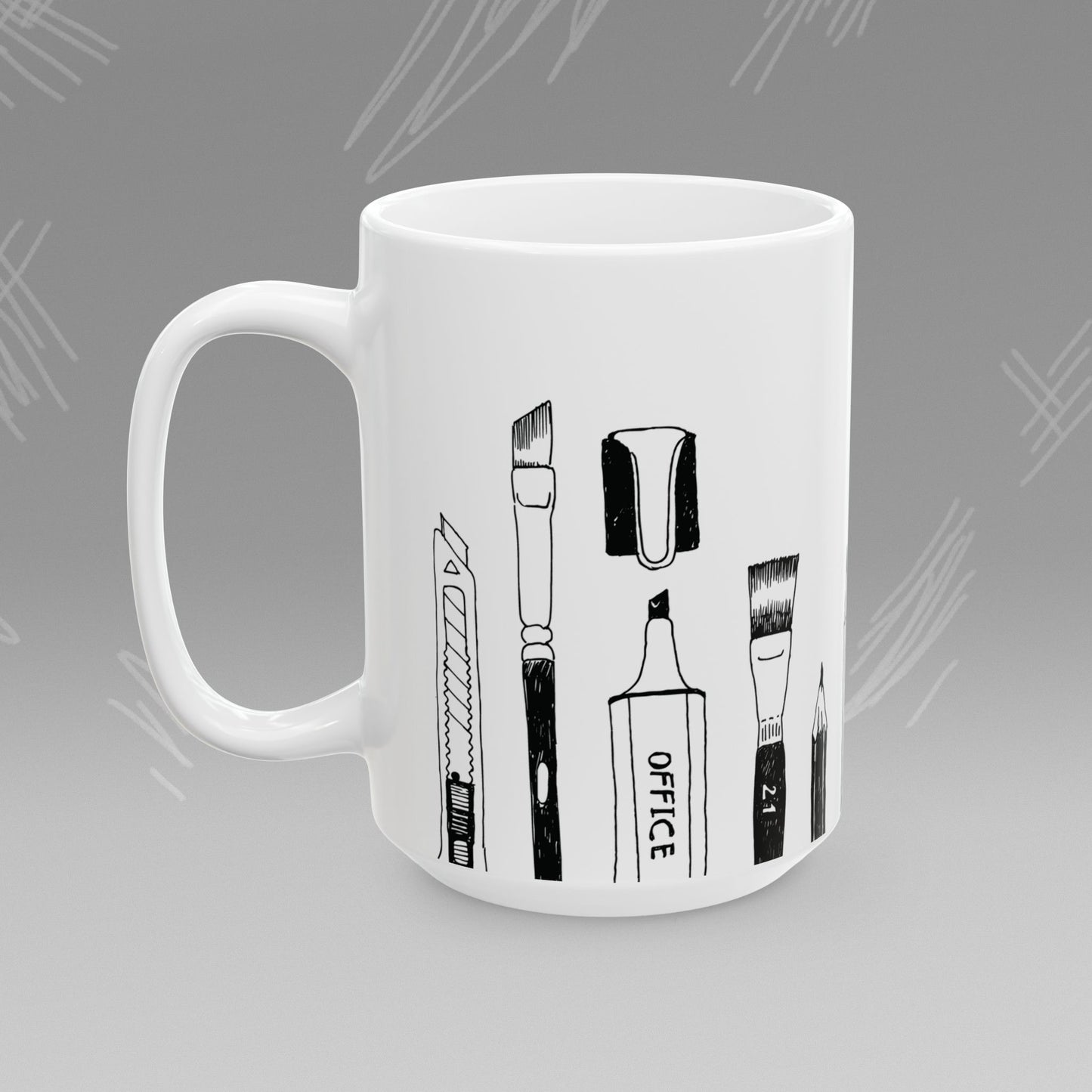 White mug with black text and illustrations of art supplies