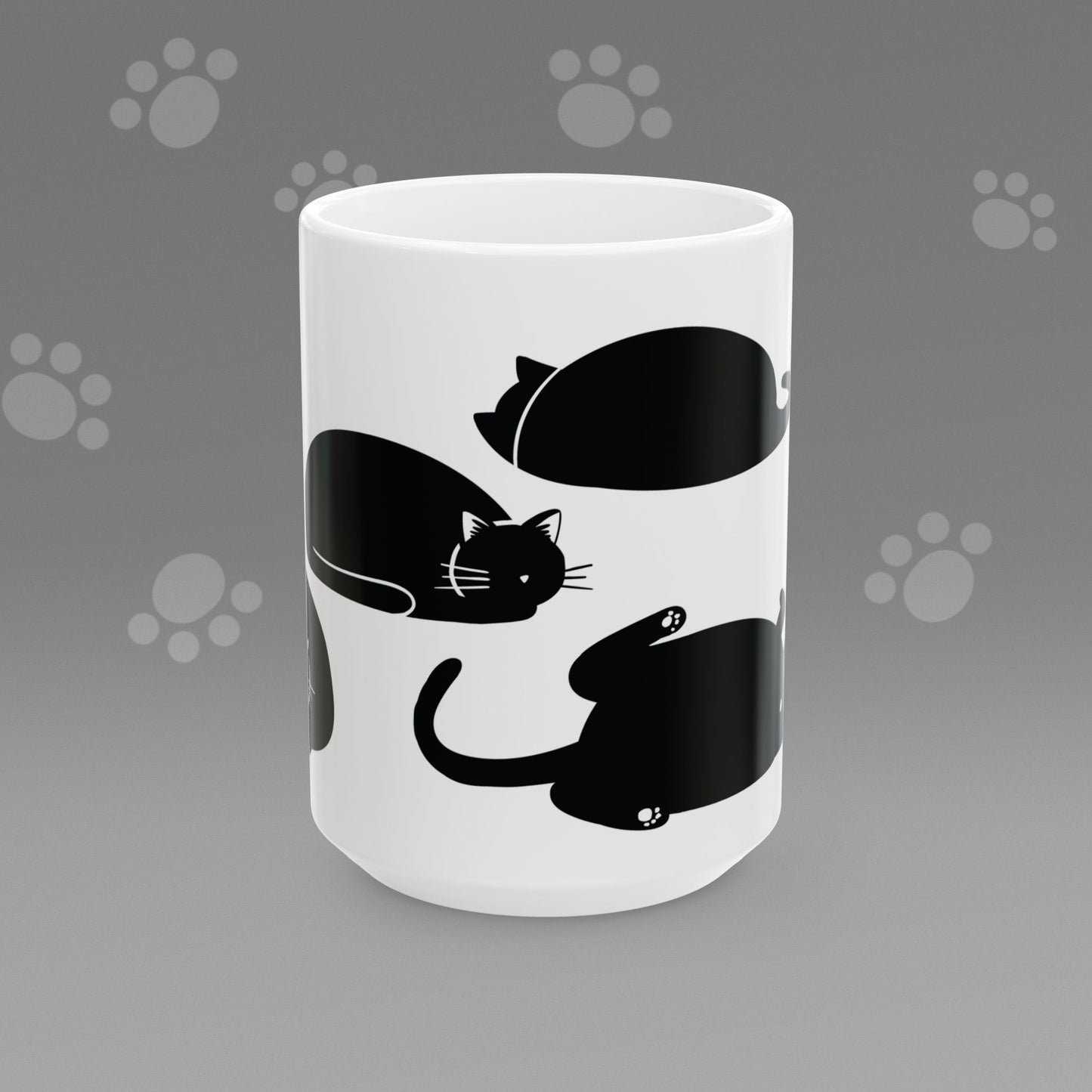 Coffee mug with fat black cat illustrations on a gray background