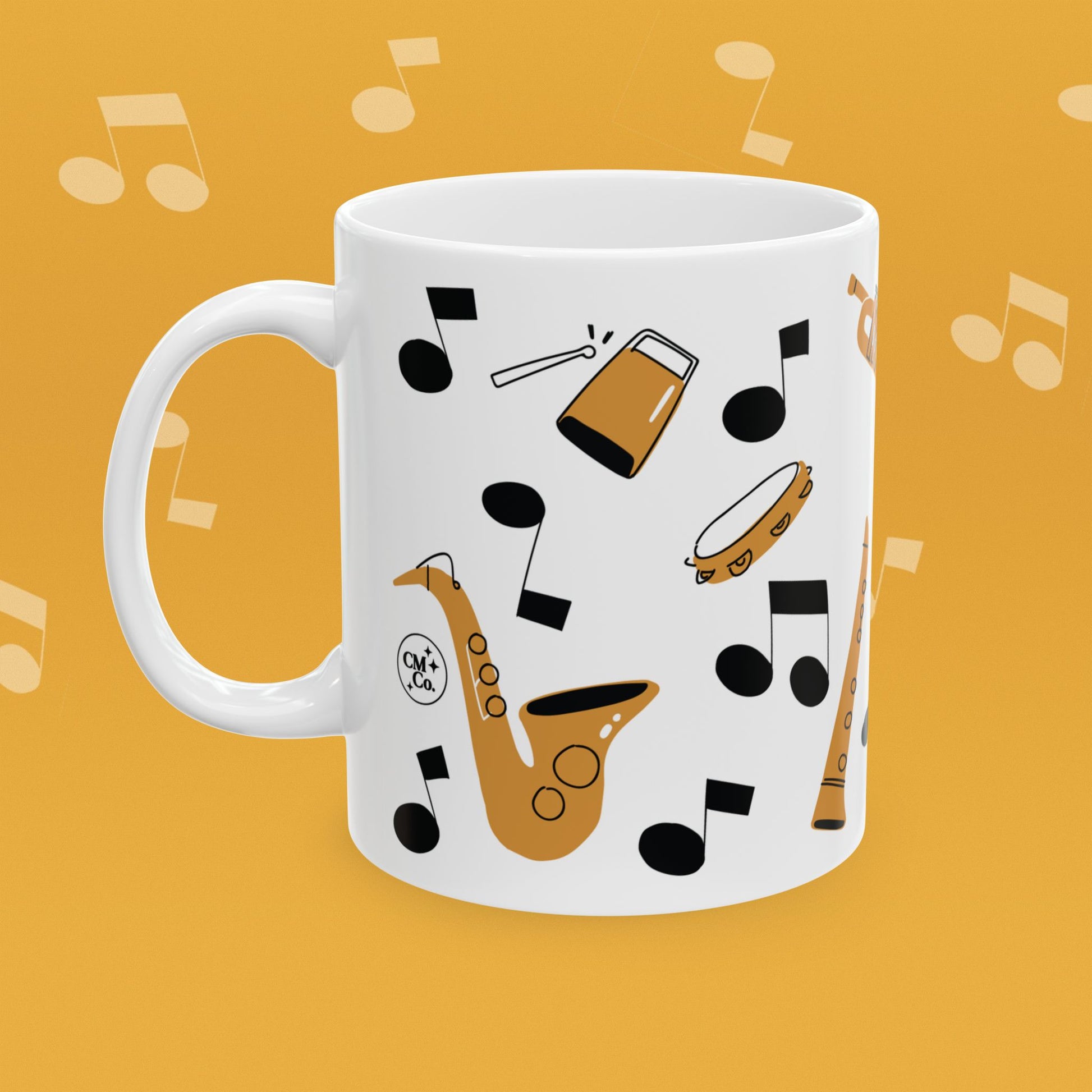 Coffee mug with musical instrument illustrations and text 'I'm with the Band' on a yellow background