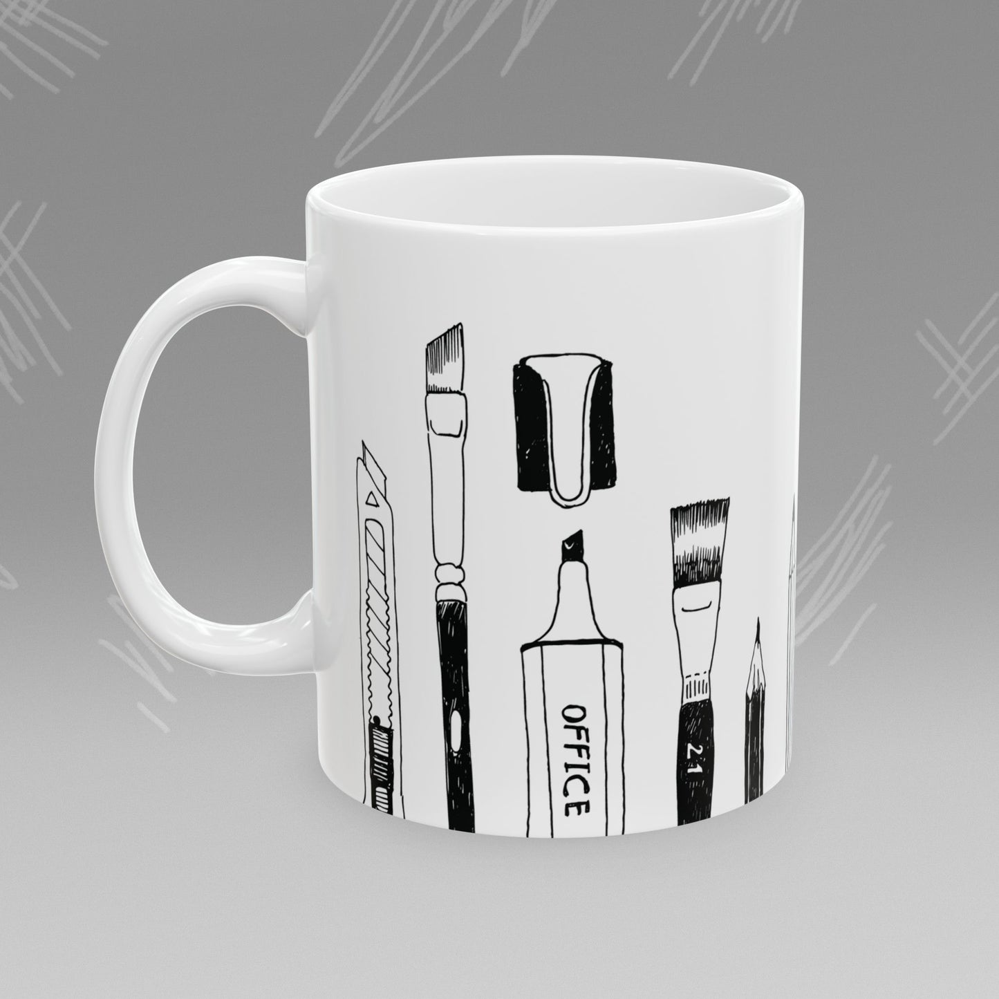 White mug with black text and illustrations of art supplies