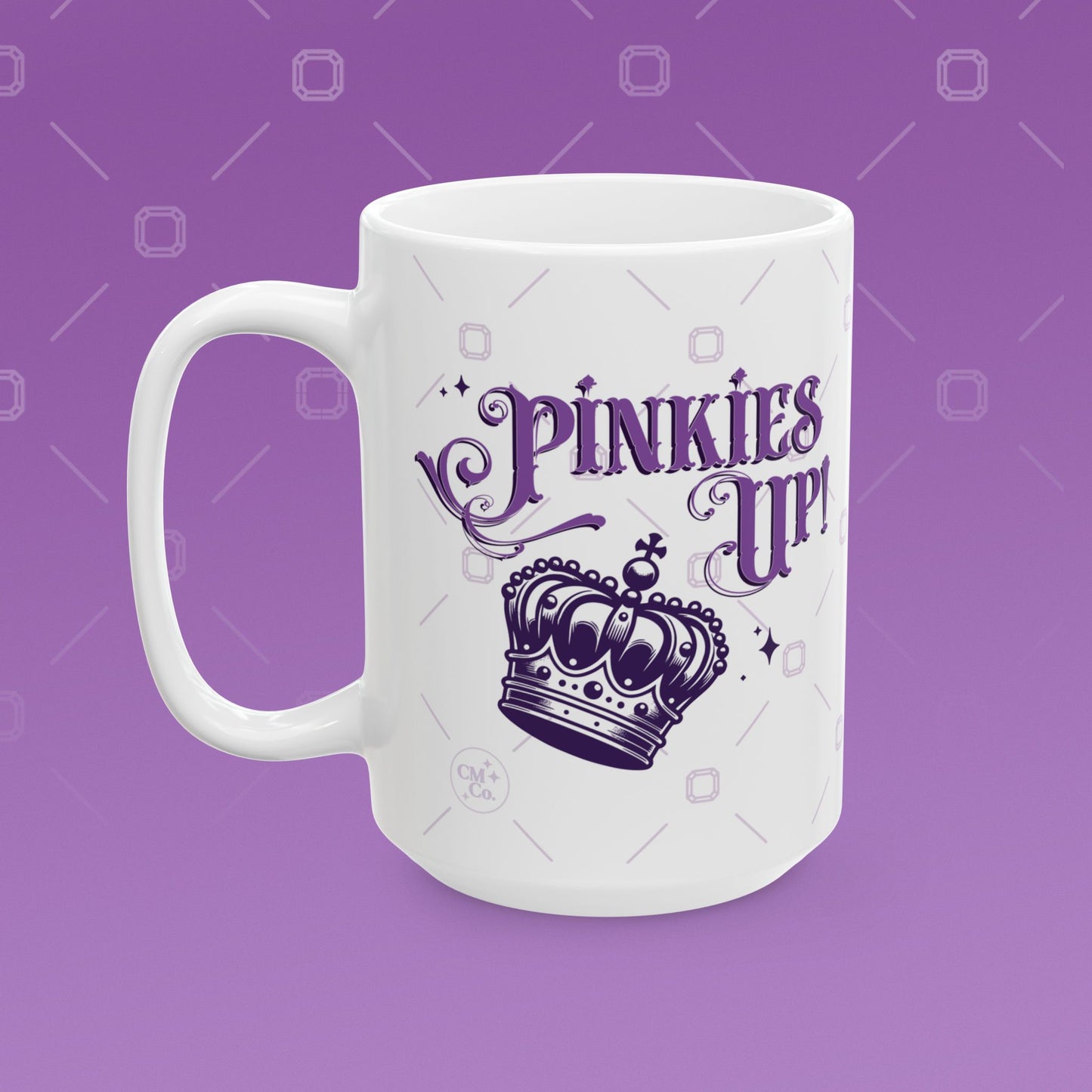 Coffee mug with the fancy text "Pinkies Up" over the illustration of a crown