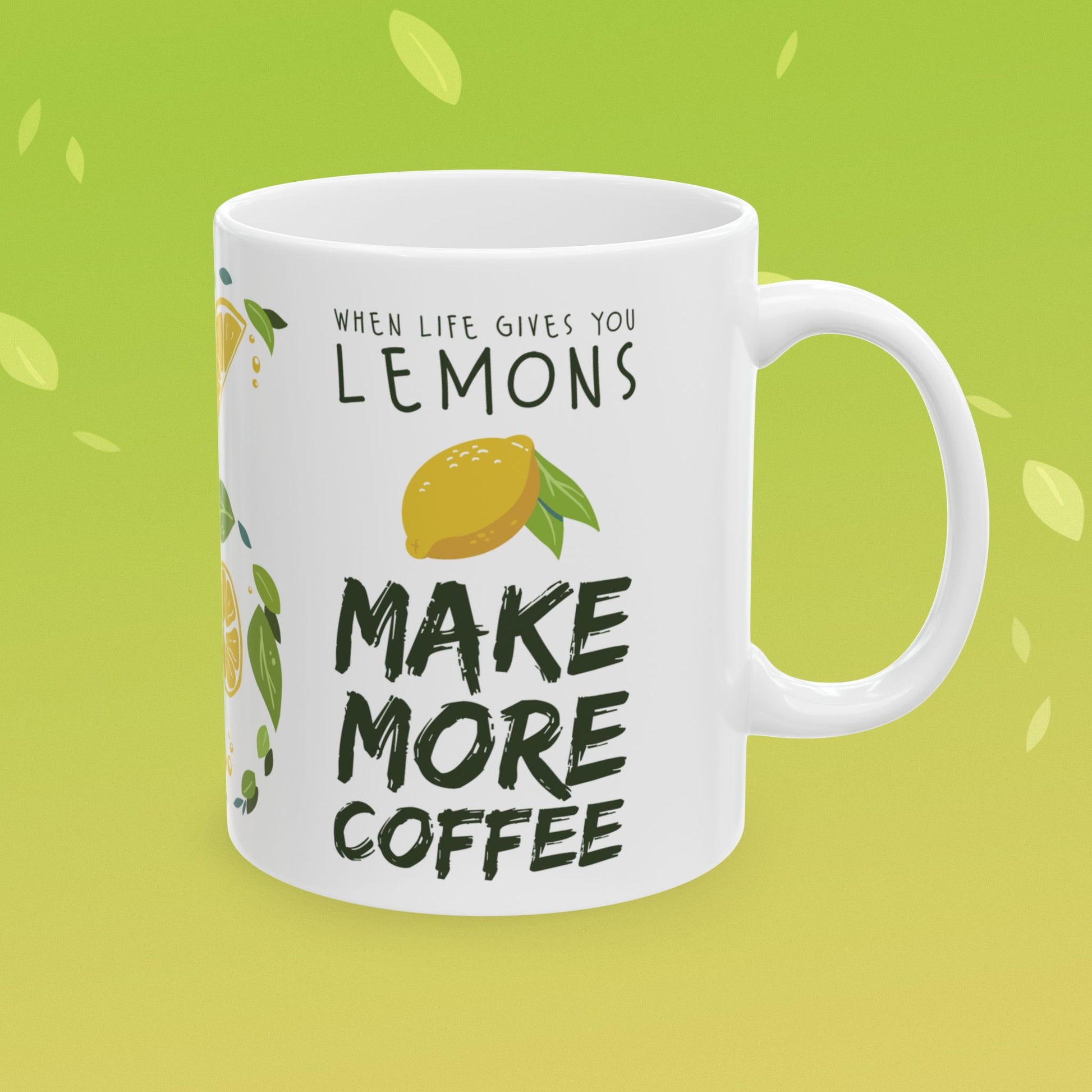 Coffee mug that reads "when life gives you lemons, make more coffee!" decorated with lemon illustrations