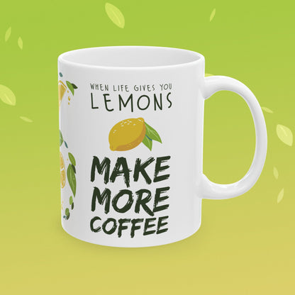 Coffee mug that reads "when life gives you lemons, make more coffee!" decorated with lemon illustrations