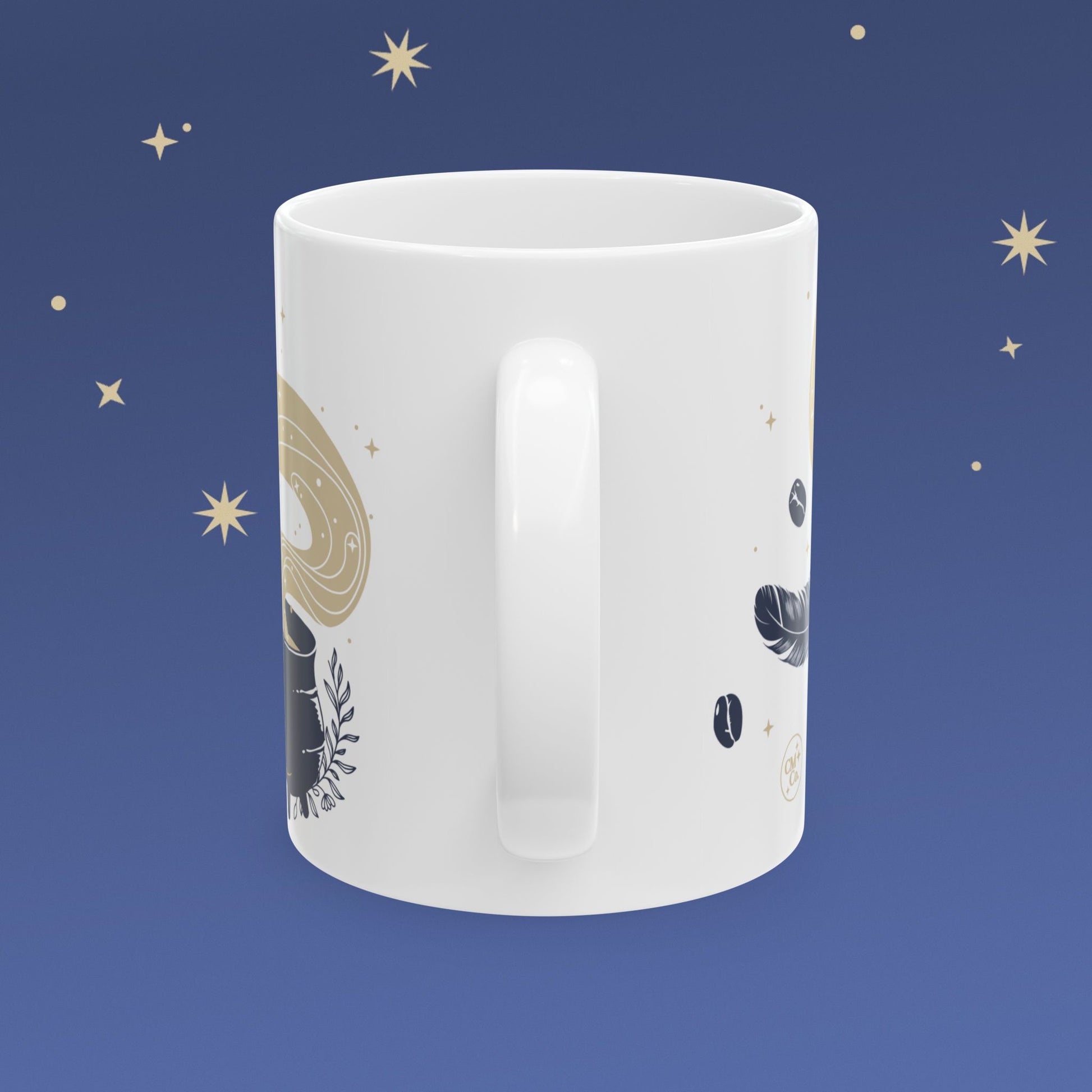 White mug with celestial design on a blue background with stars