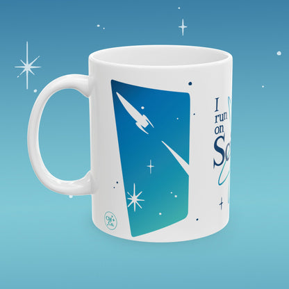 Coffee mug illustrated with image of outer space and retro type that reads "I run on Science"