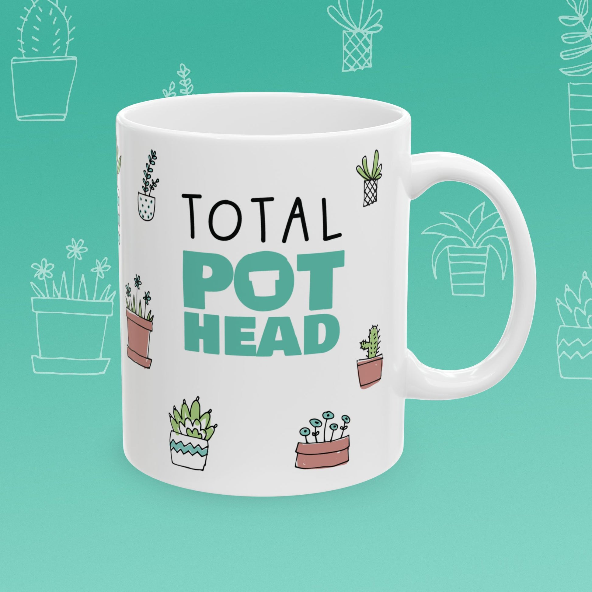 White mug with 'Total Pot Head' text and plant illustrations on a teal background