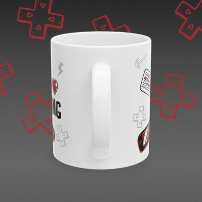 White mug with 'I ❤️ Gaming' design covered in illustrated game controllers