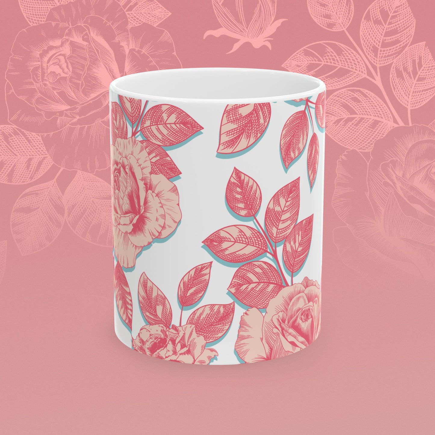 coffee mug decorated with blooming roses in shades of pink.