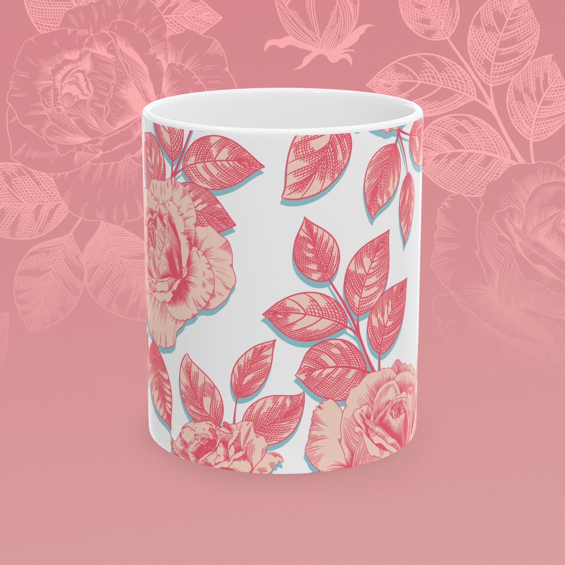 coffee mug decorated with blooming roses in shades of pink.