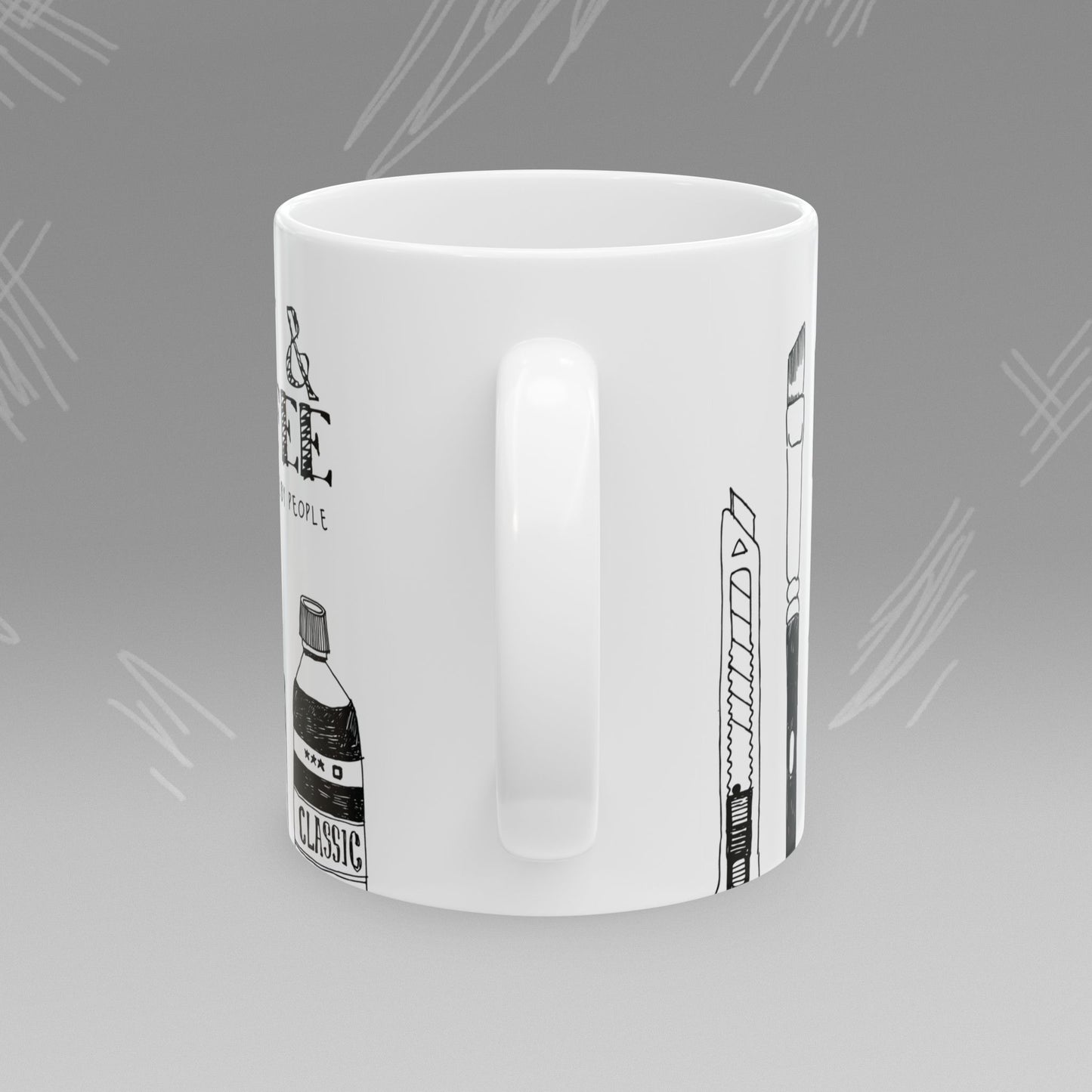 White mug with black text and illustrations of art supplies