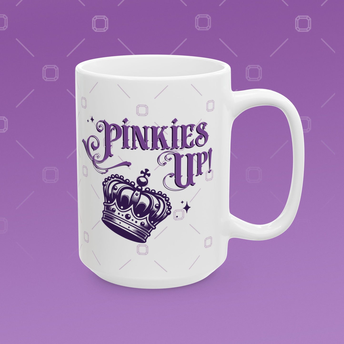 Coffee mug with the fancy text "Pinkies Up" over the illustration of a crown