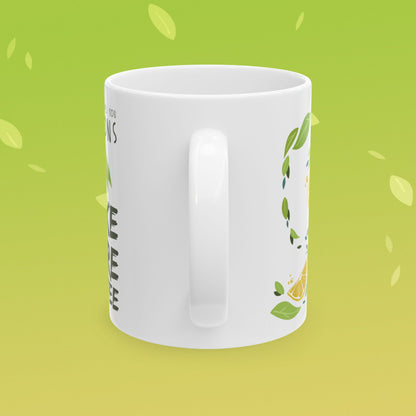 Coffee mug that reads "when life gives you lemons, make more coffee!" decorated with lemon illustrations