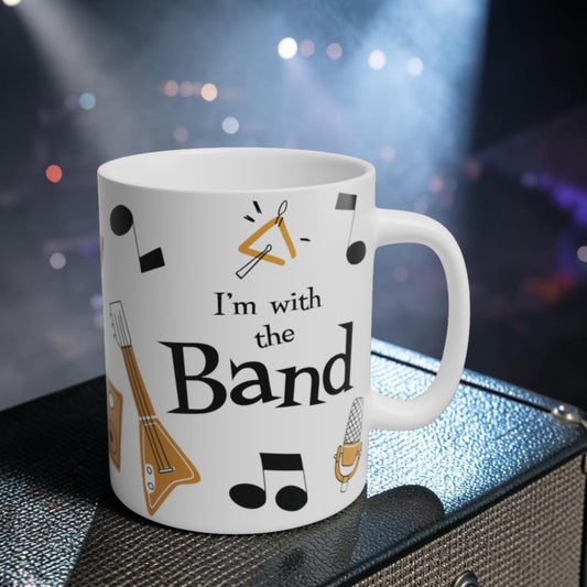 Coffee mug with musical instrument illustrations and text 'I'm with the Band' 