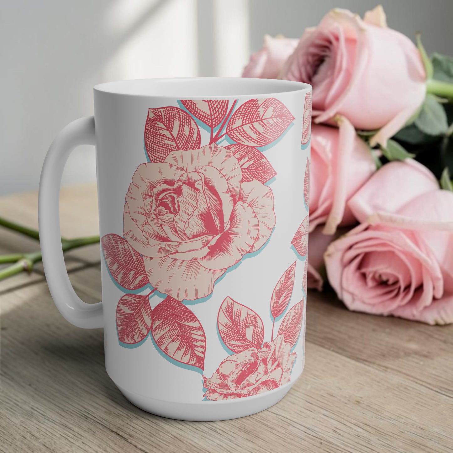 coffee mug decorated with blooming roses in shades of pink.